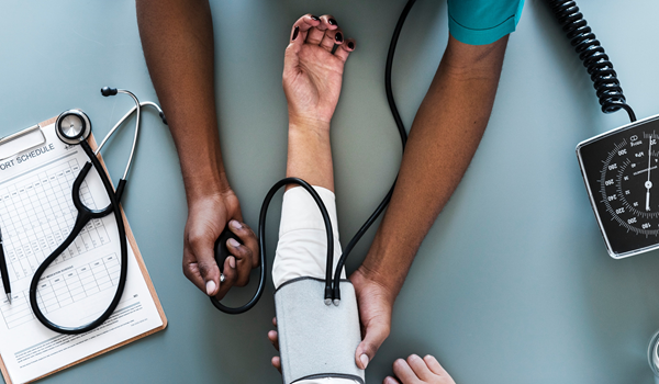 Nurse taking patients blood pressure